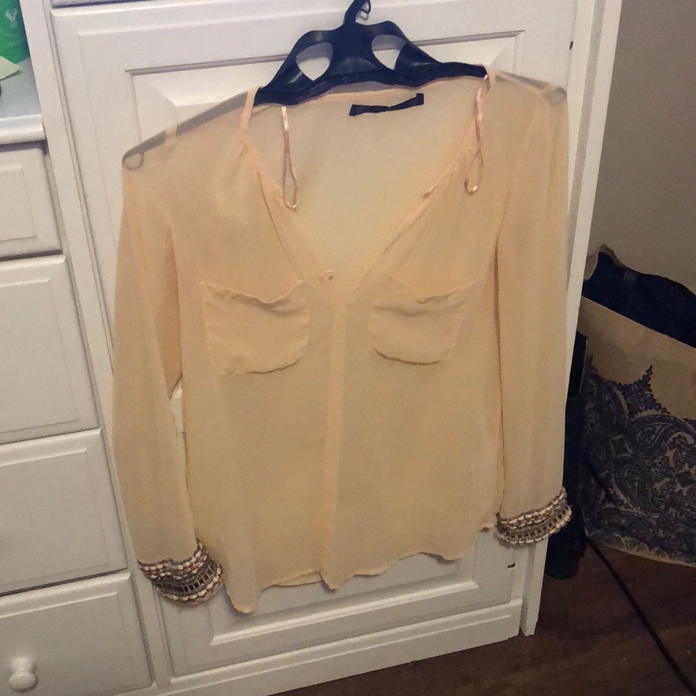 Pale pink top with beaded sleeve